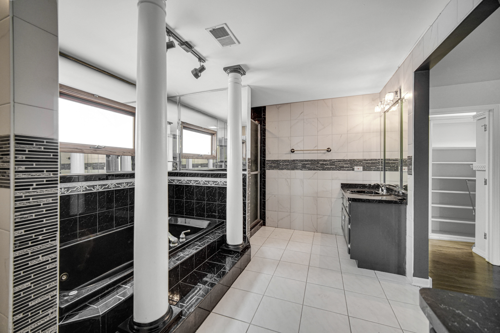 15516 Frontage Road Markham, IL 60428 - Photo 21 of 36 a kitchen with granite countertop a refrigerator and a stove