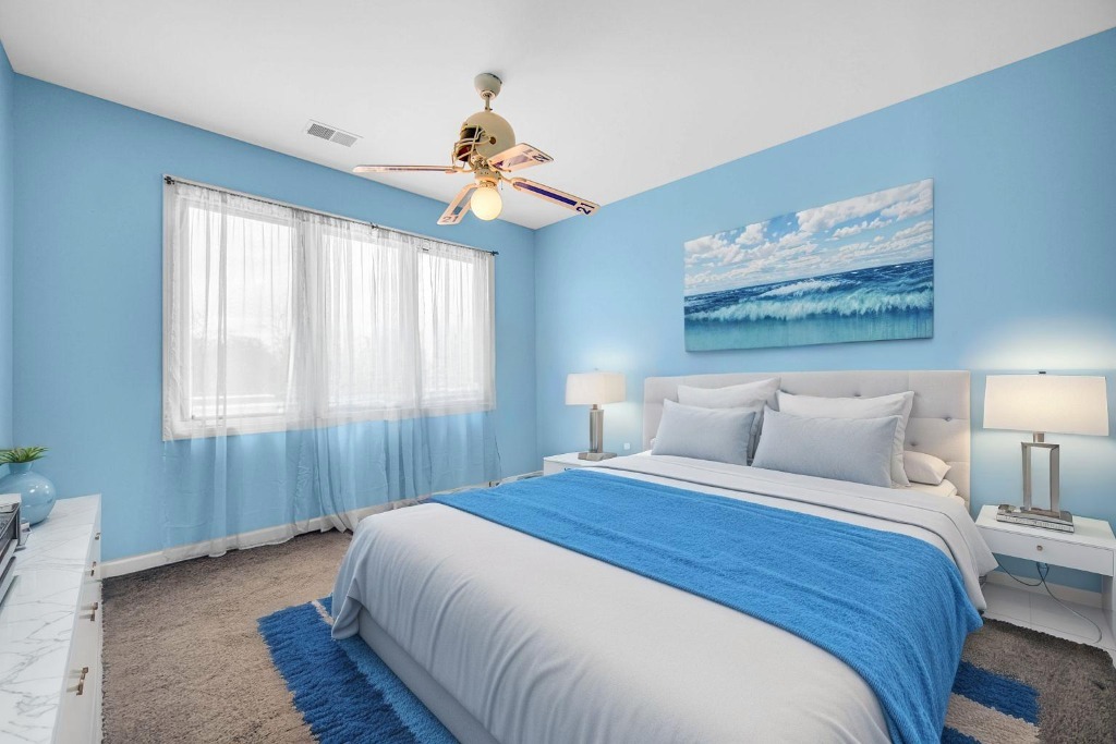 15516 Frontage Road Markham, IL 60428 - Photo 23 of 36 a bedroom with a large bed and a chandelier