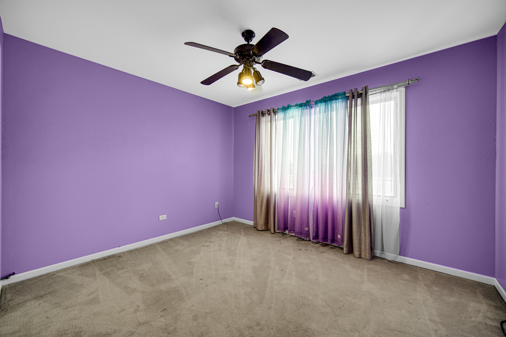 15516 Frontage Road Markham, IL 60428 - Photo 29 of 36 an empty room with ceiling fan and window