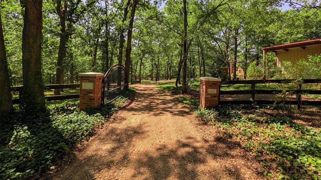 7451 County Road 1509 Athens, TX 75751 - Photo 27 of 36 a view of a bench in a garden
