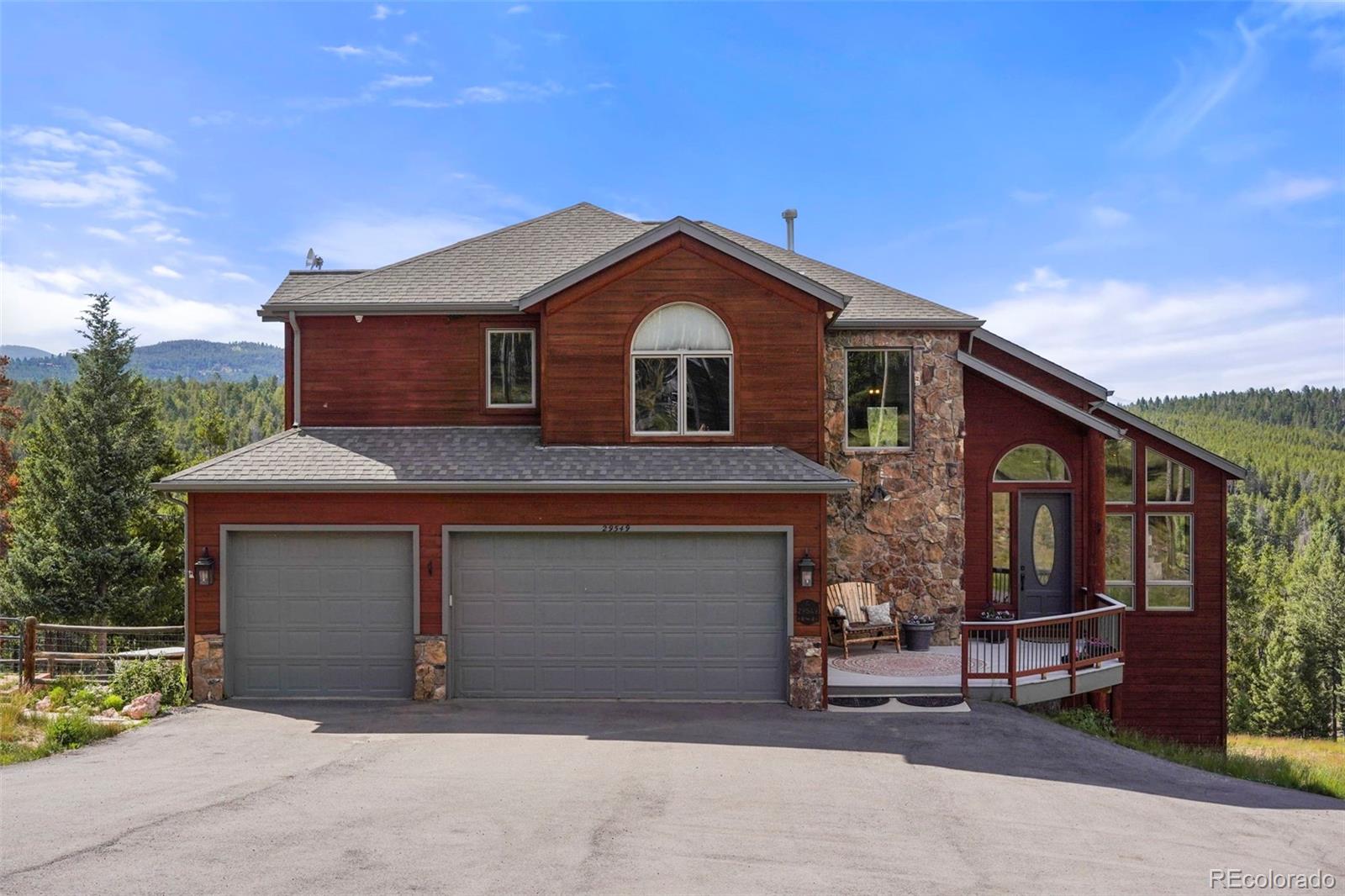 a front view of a house with a garage