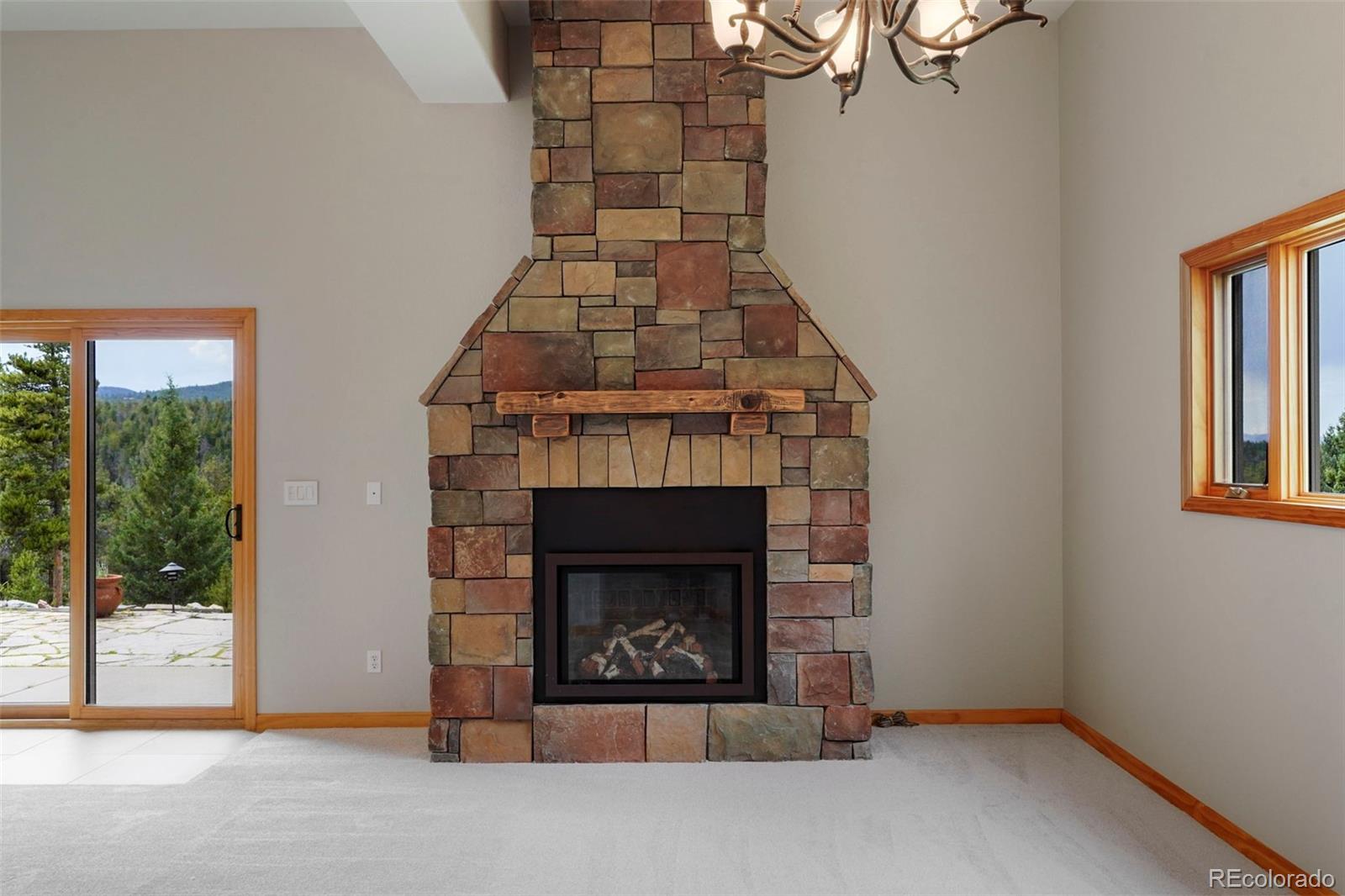 29549 Thunderbolt Circle Conifer, CO 80433 - Photo 25 of 50 a living room with a fireplace