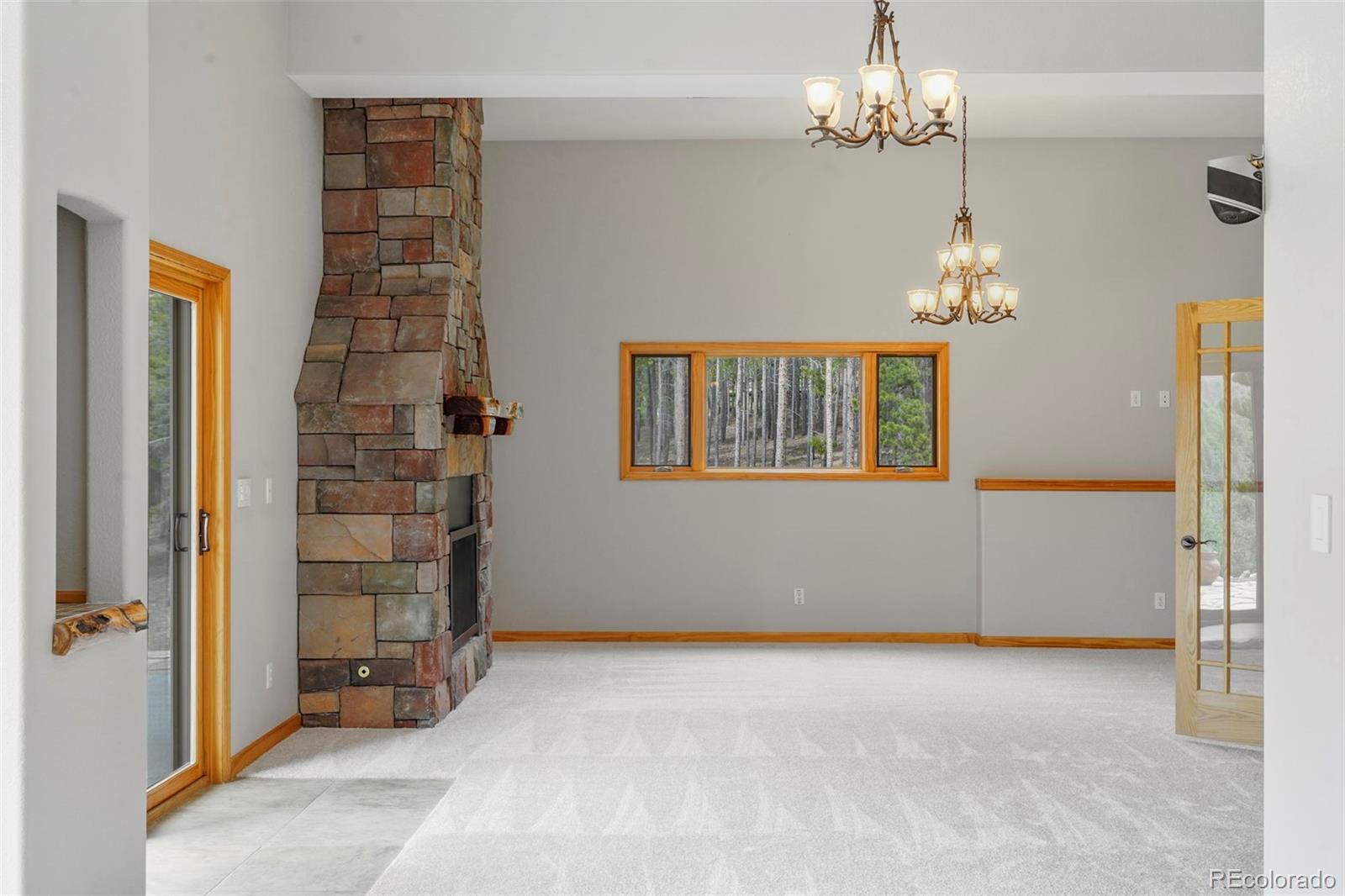 29549 Thunderbolt Circle Conifer, CO 80433 - Photo 26 of 50 wooden floor in an empty room with a window
