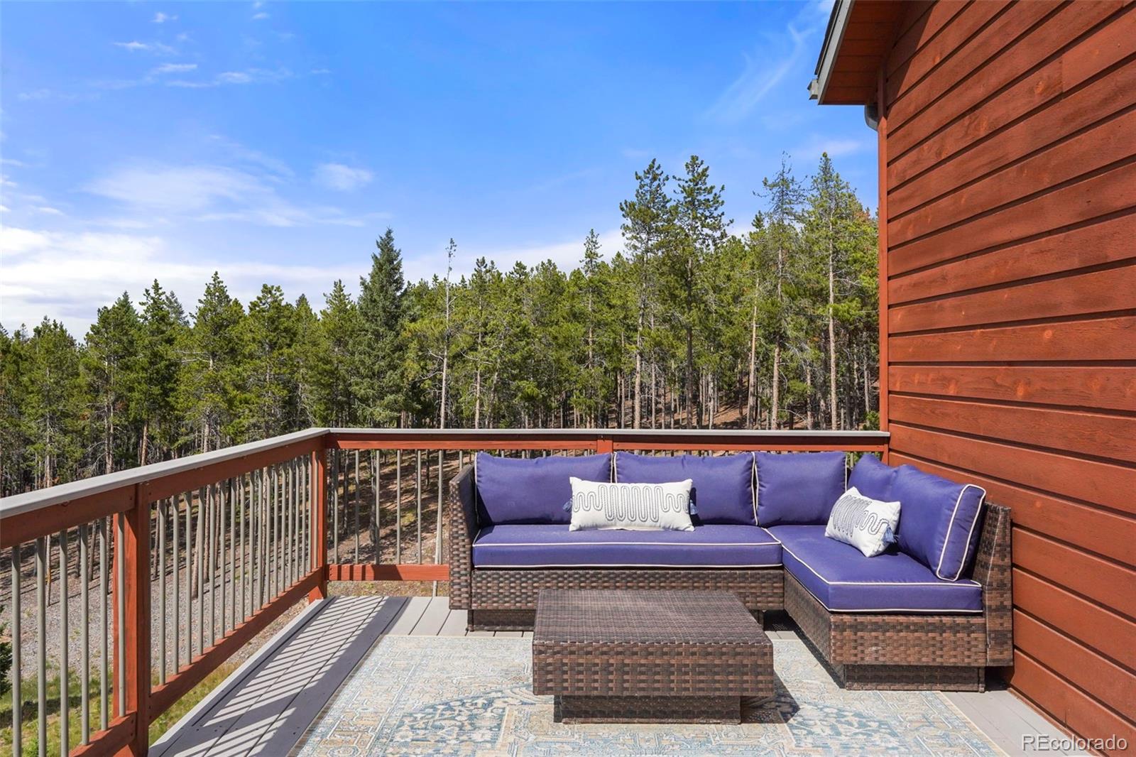 29549 Thunderbolt Circle Conifer, CO 80433 - Photo 37 of 50 a view of a balcony with furniture