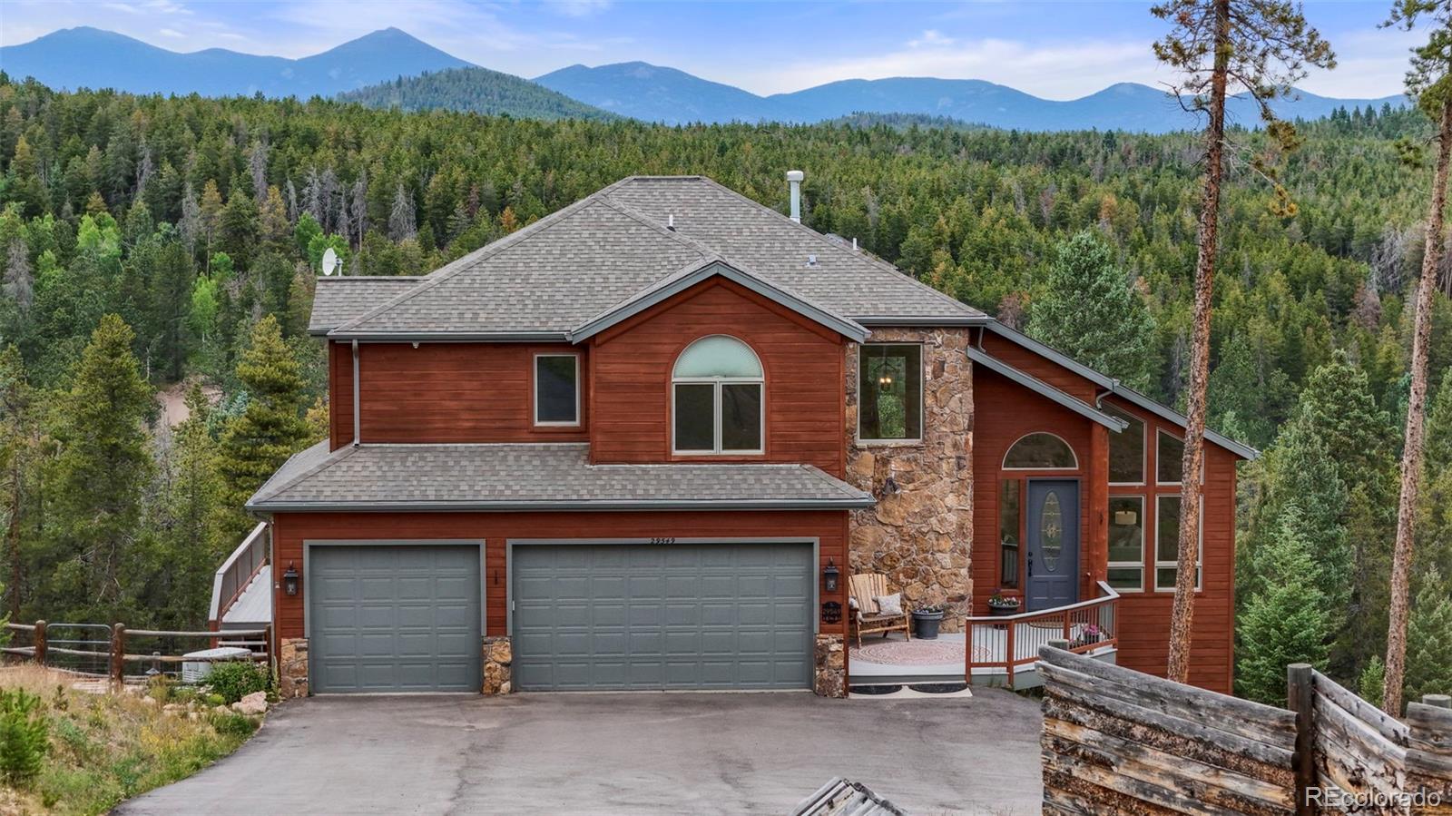 29549 Thunderbolt Circle Conifer, CO 80433 - Photo 40 of 50 a view of a house with a yard and balcony