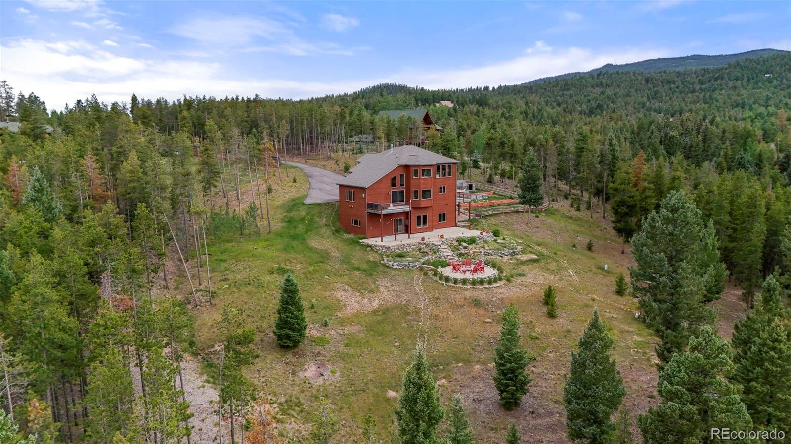 29549 Thunderbolt Circle Conifer, CO 80433 - Photo 43 of 50 a view of a town with trees in the background