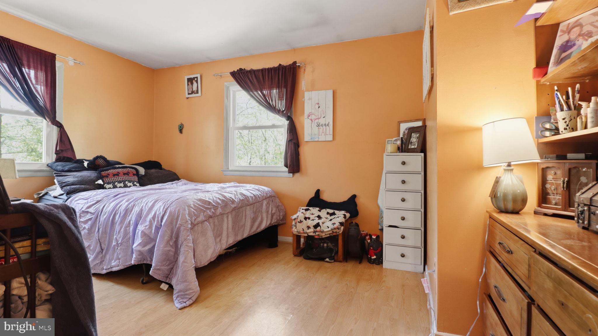 13408 Kris Ran Court Fort Washington, MD 20744 - Photo 14 of 49 Cozy bedroom with warm orange hues.