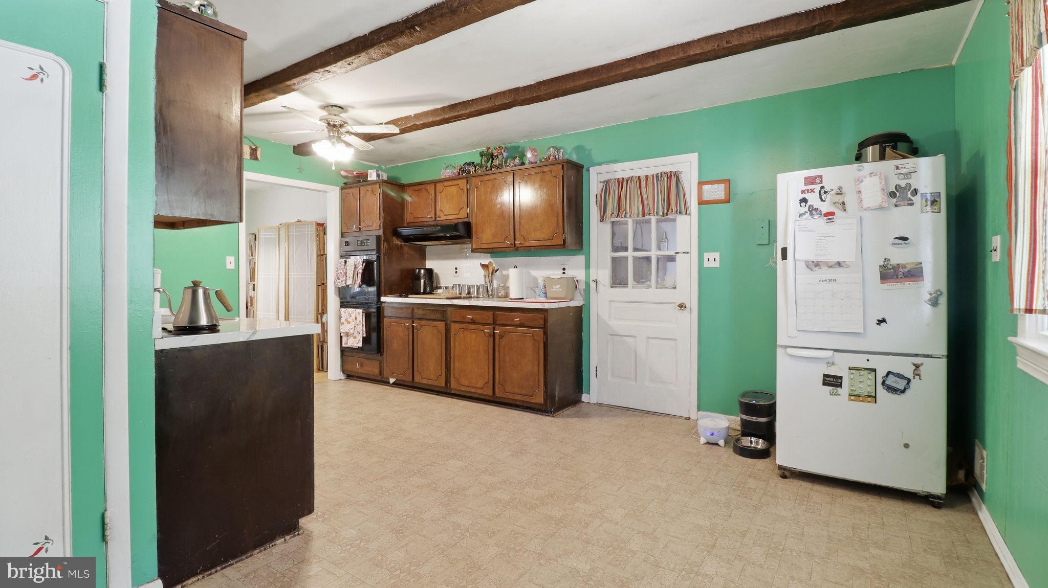 13408 Kris Ran Court Fort Washington, MD 20744 - Photo 10 of 49 Charming kitchen with vibrant green walls.