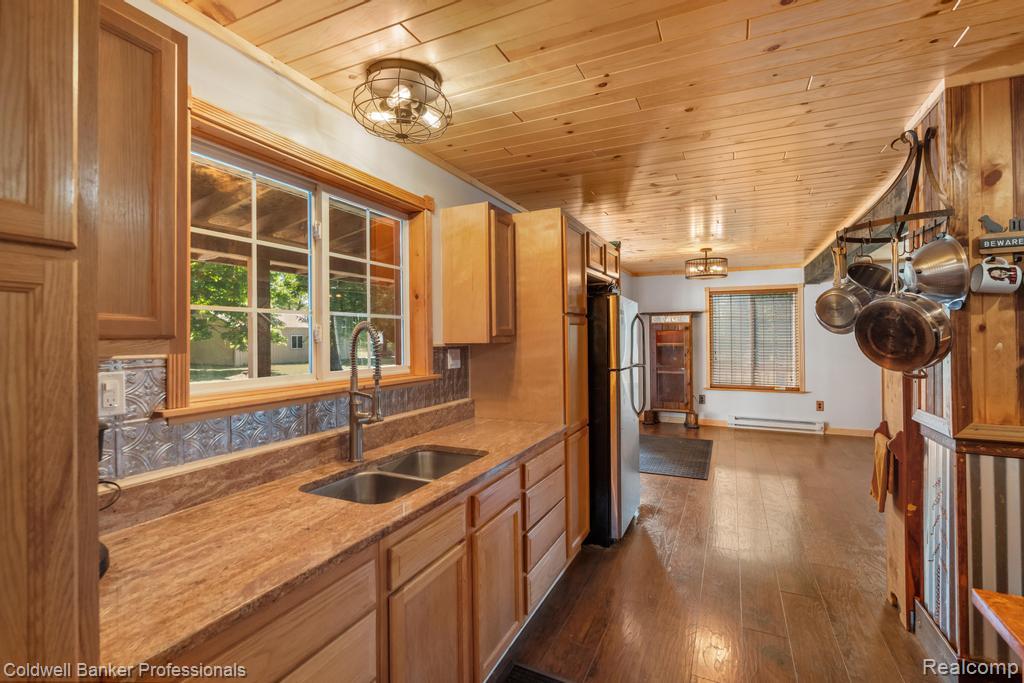 6389 Postlewait Road Mancelona, MI 49659 - Photo 17 of 50 Wood-finish flooring with a wood plank ceiling and recessed lighting