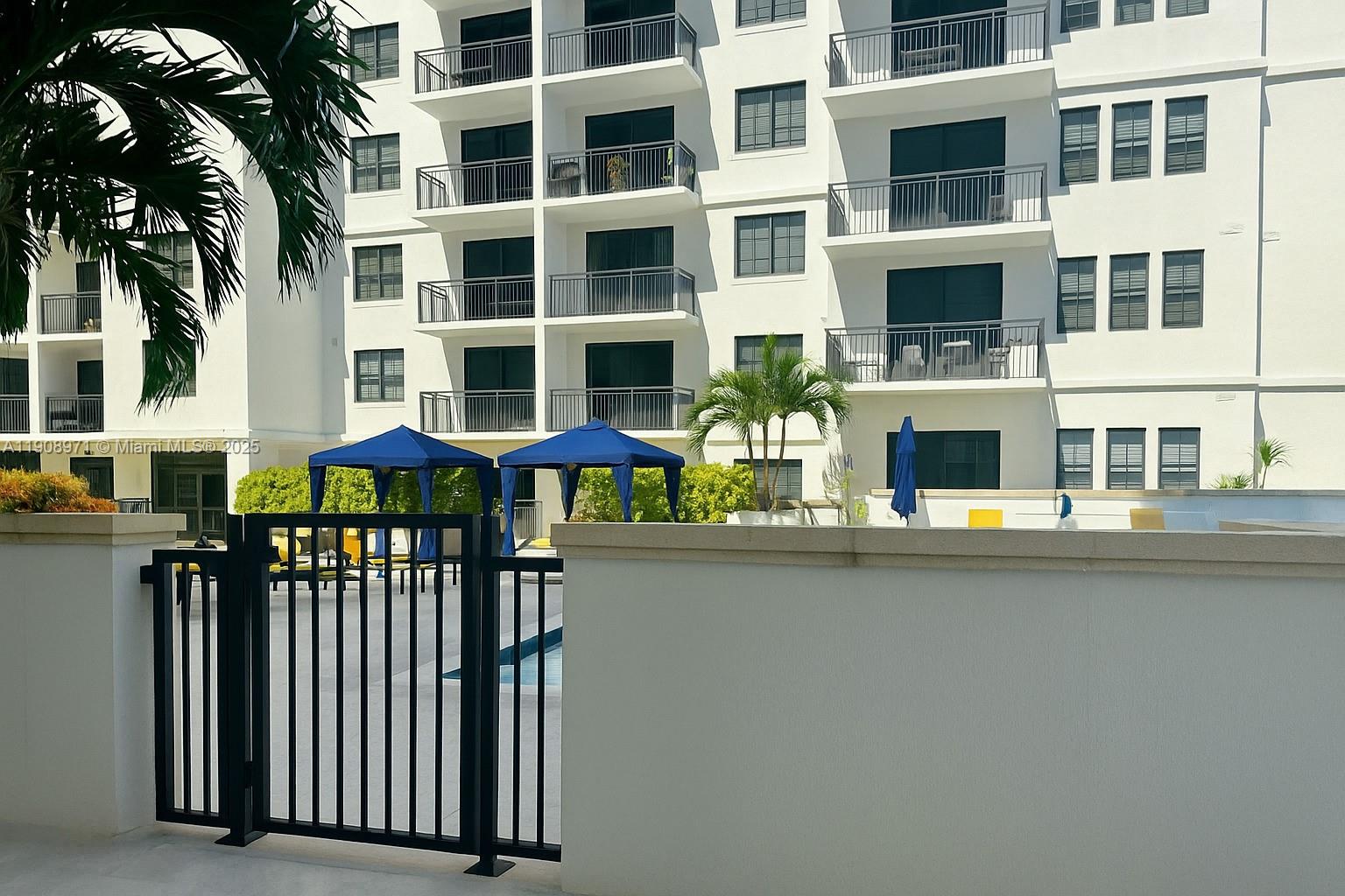 101 East Camino Real, Unit 517 Boca Raton, FL 33432 - Photo 11 of 12 a view of a house with a porch and furniture