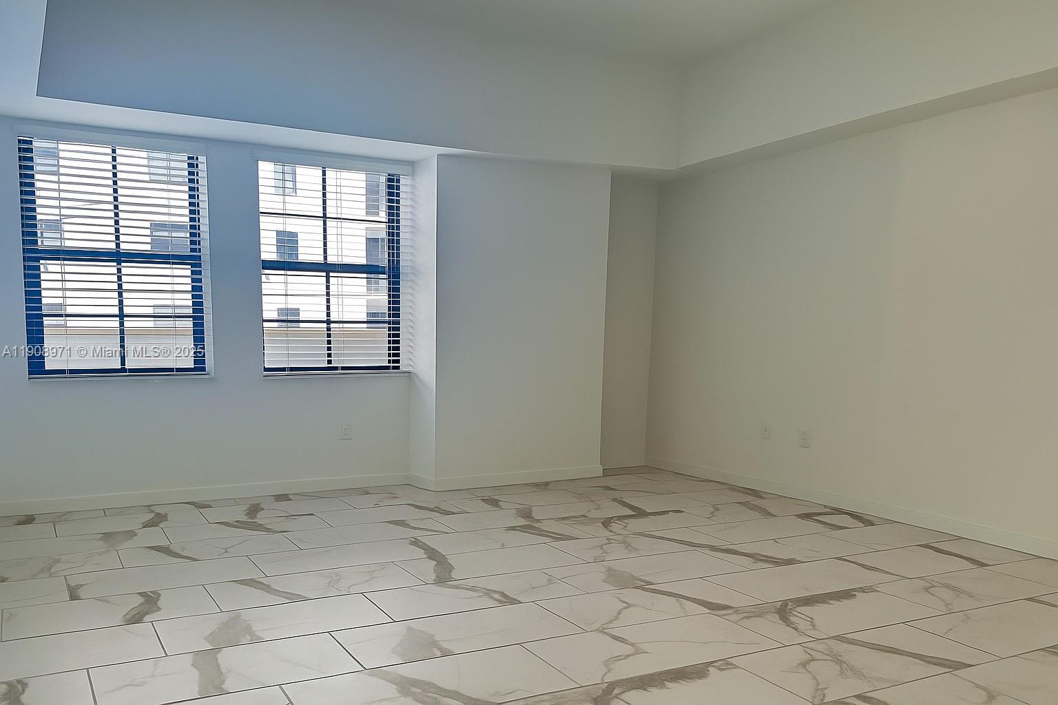 101 East Camino Real, Unit 517 Boca Raton, FL 33432 - Photo 6 of 12 a view of room with window
