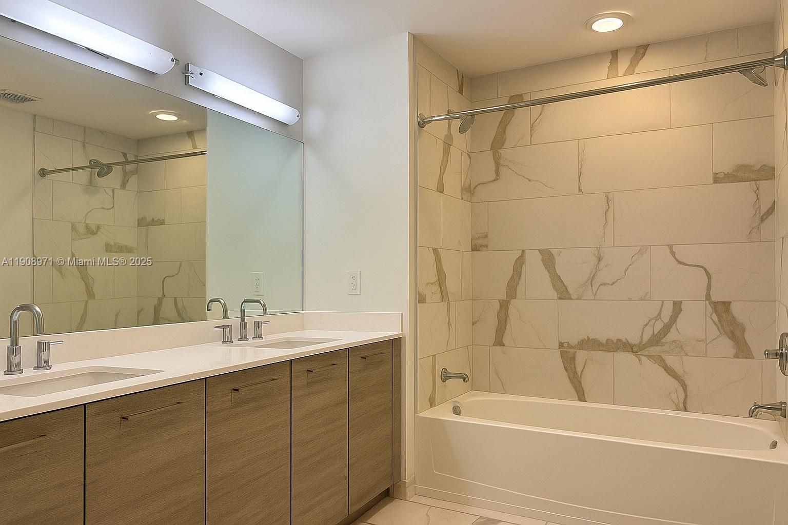 101 East Camino Real, Unit 517 Boca Raton, FL 33432 - Photo 9 of 12 a bathroom with a sink and a bathtub