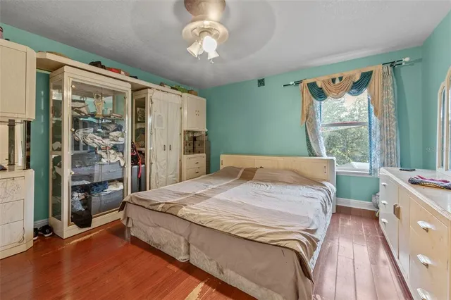 a spacious bedroom with a large bed and a window