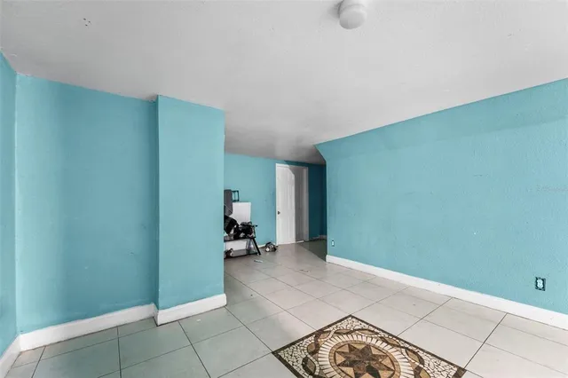 a kitchen with a refrigerator and a sink