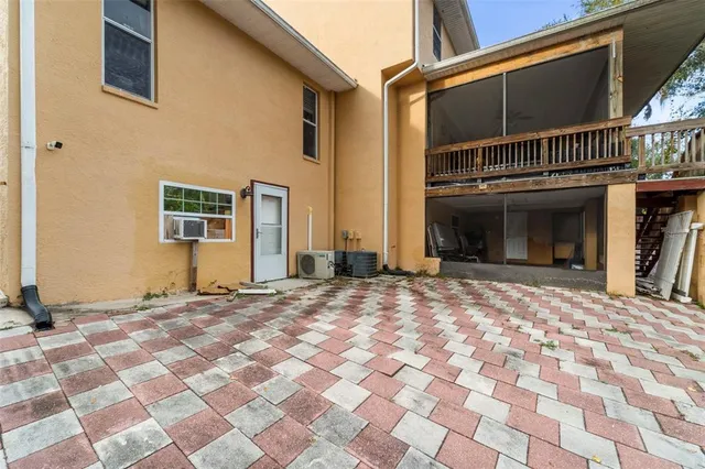 a backyard of a house with a tree