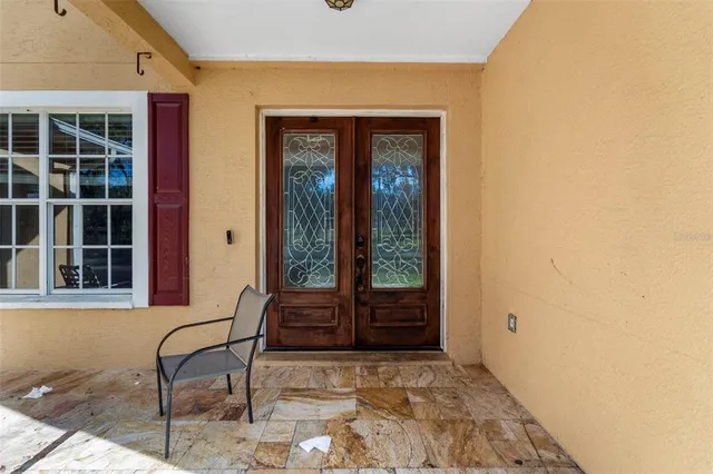 a front view of a house with a large window