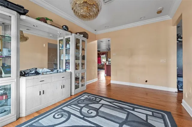 a view of an entryway with wooden floor