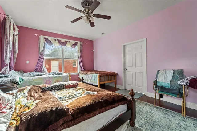 a bedroom with a bed and a chair