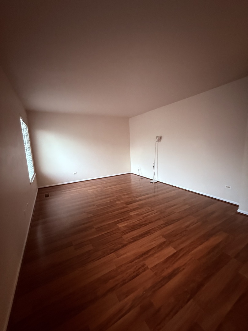 412 Clifton Lane Bolingbrook, IL 60440 - Photo 6 of 12 a view of empty room with wooden floor