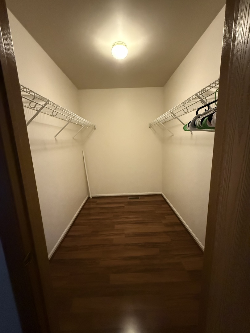 412 Clifton Lane Bolingbrook, IL 60440 - Photo 7 of 12 wooden floor in an empty room