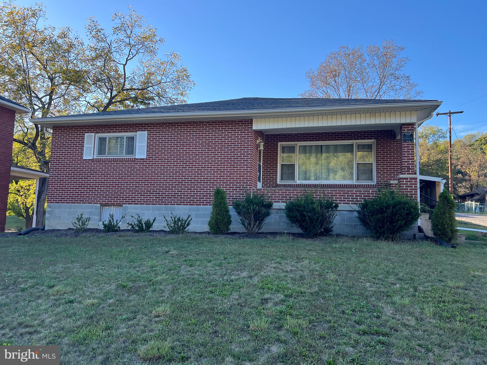 11915 Bedford Road Northeast Cumberland, MD 21502 - Photo 1 of 34 a view of a house with a backyard