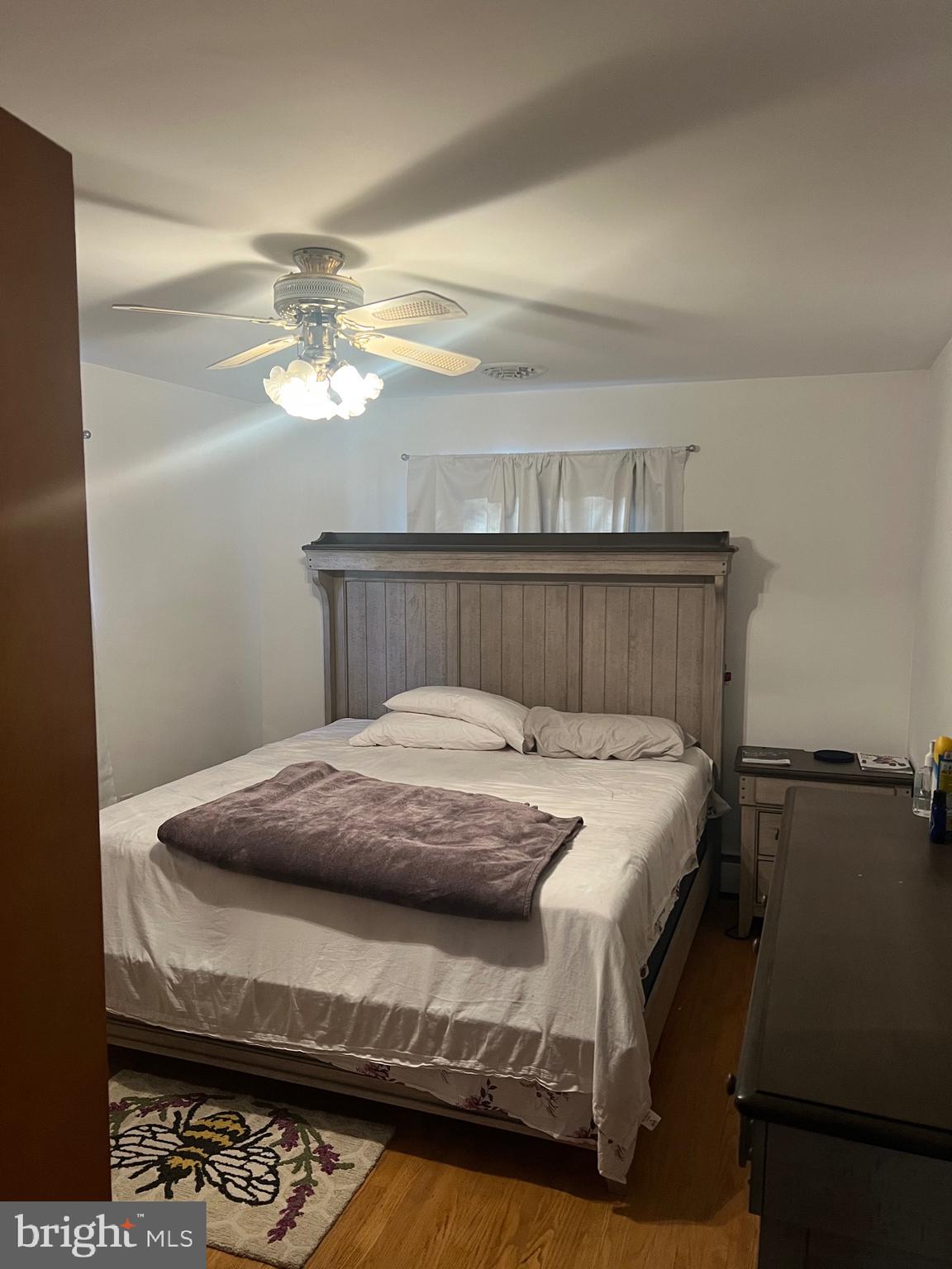 11915 Bedford Road Northeast Cumberland, MD 21502 - Photo 12 of 34 a bed sitting in a bedroom next to a window