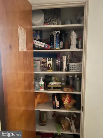 a shelf with cup and plates