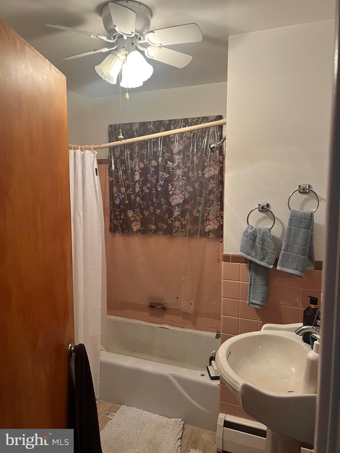 11915 Bedford Road Northeast Cumberland, MD 21502 - Photo 20 of 34 a bathroom with a sink and a mirror