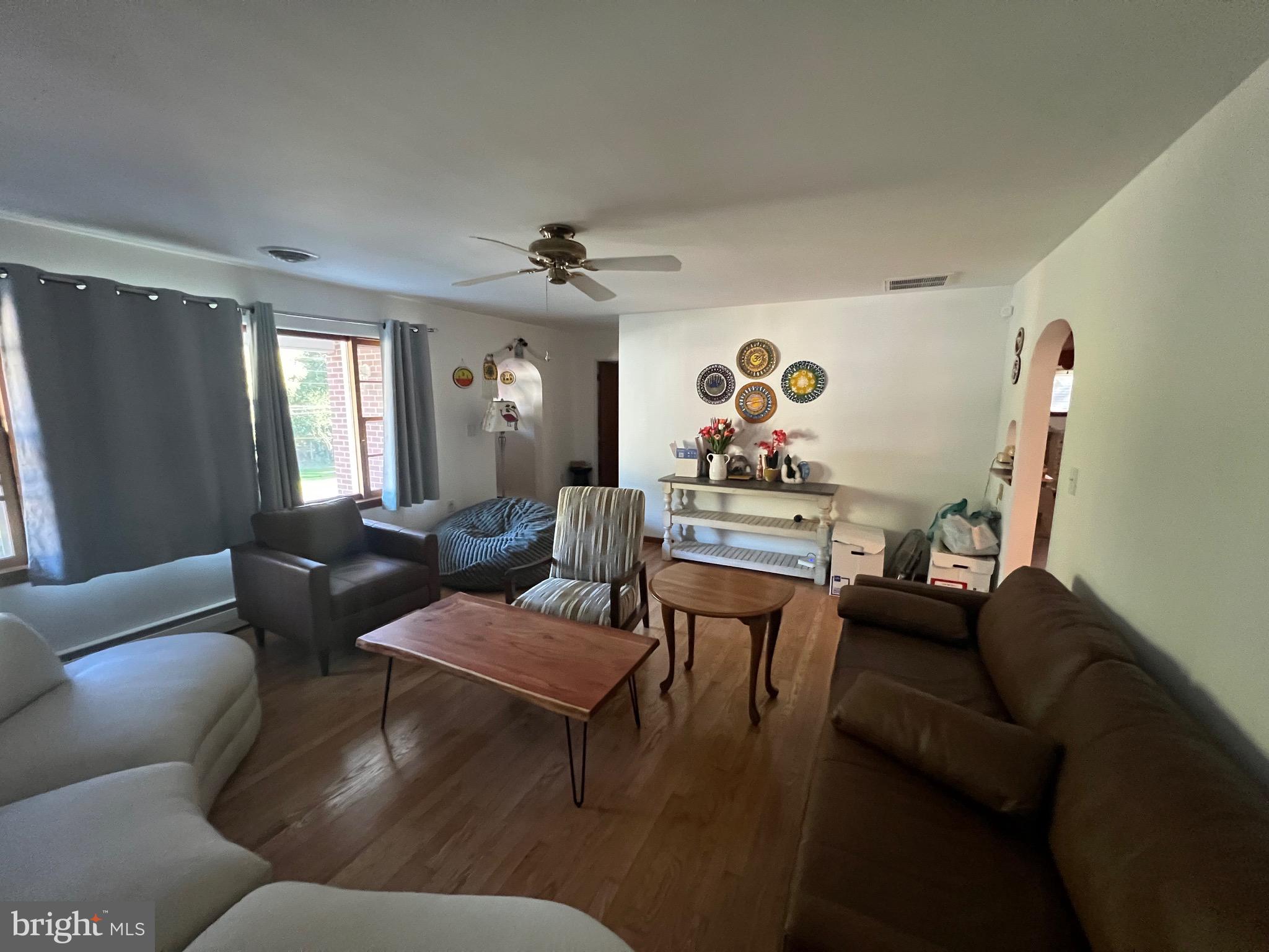 11915 Bedford Road Northeast Cumberland, MD 21502 - Photo 10 of 34 a living room with furniture and a chandelier