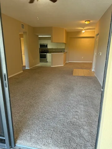 wooden floor in an empty room with a fireplace