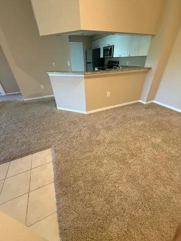 a view of a kitchen with a sink