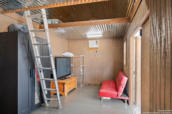 a room with furniture and air conditioner