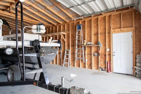 a view of a room with chairs and furniture