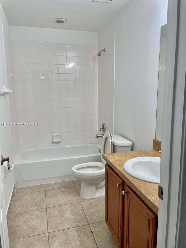 804 Quartz Terrace West Palm Beach, FL 33413 - Photo 15 of 15 a bathroom with a sink a toilet and bathtub