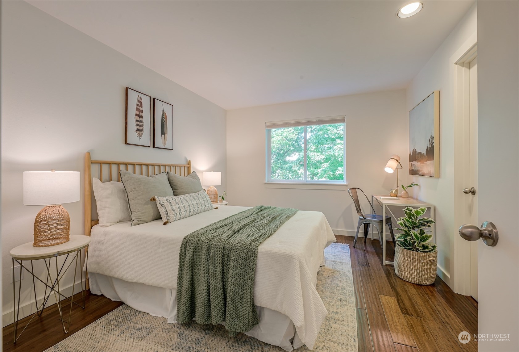 3912 Midvale Avenue North, Unit 201 Seattle, WA 98103 - Photo 19 of 22 a bedroom with a bed and a window