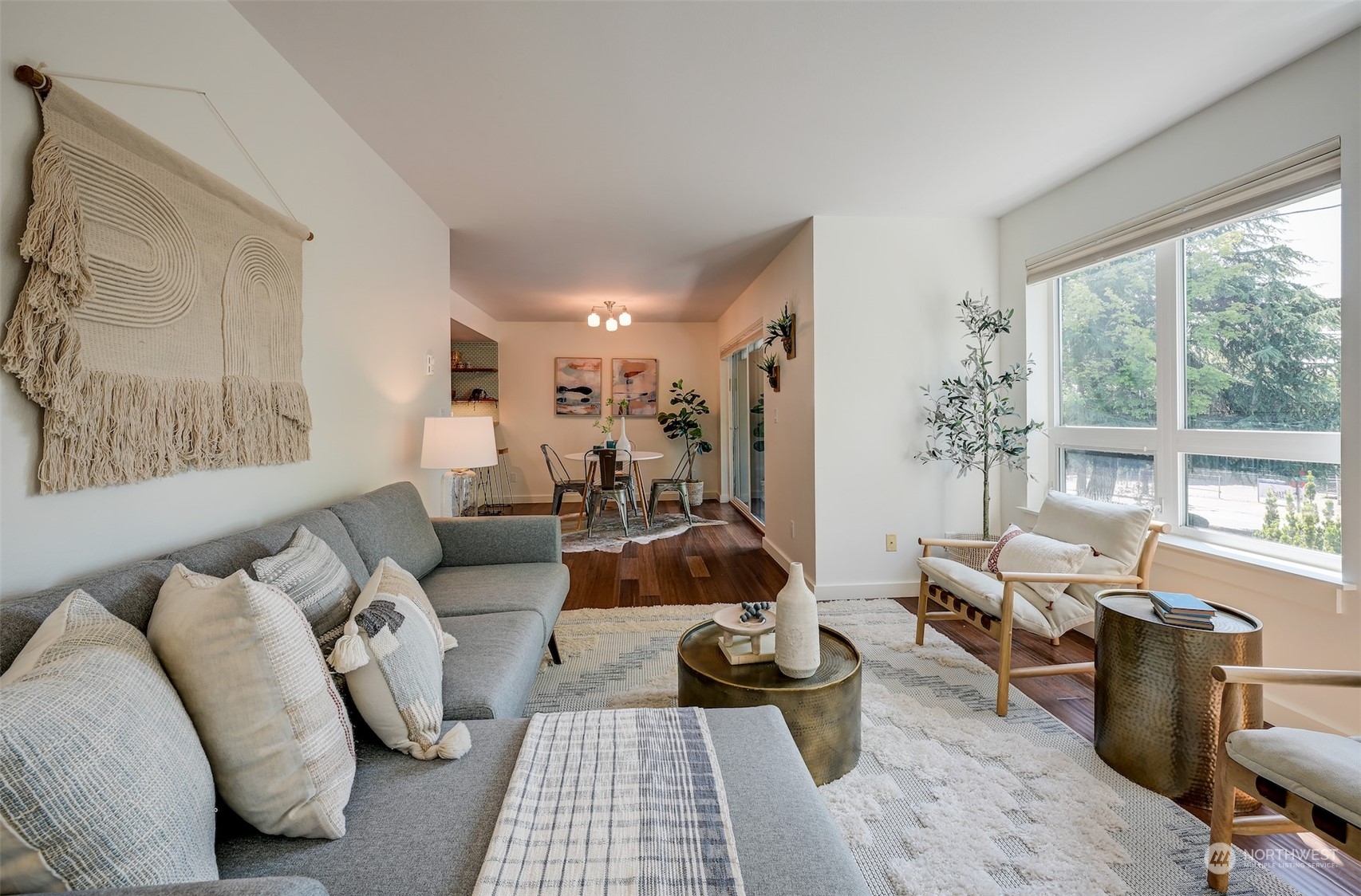 3912 Midvale Avenue North, Unit 201 Seattle, WA 98103 - Photo 2 of 22 a living room with furniture and a large window