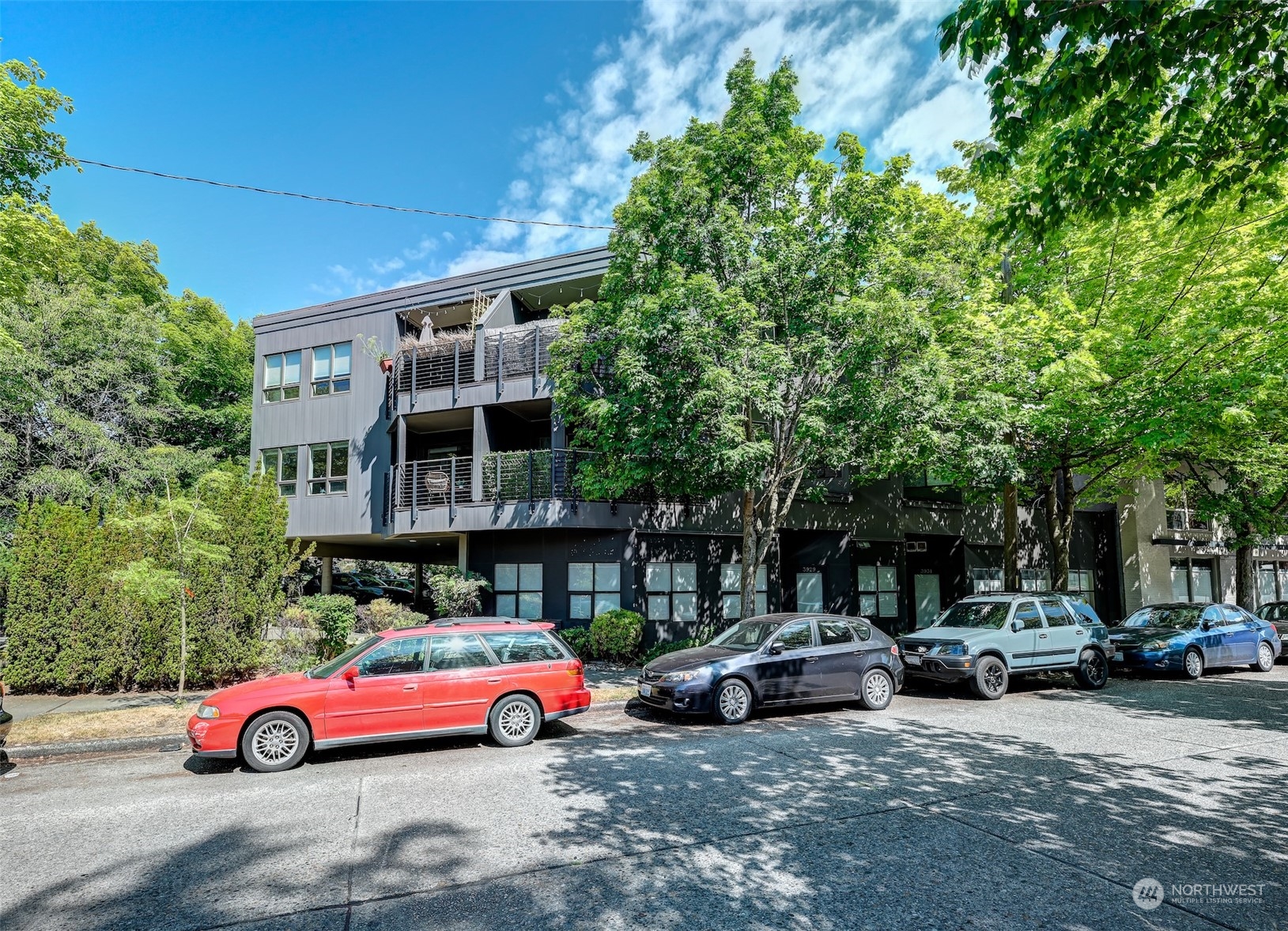 3912 Midvale Avenue North, Unit 201 Seattle, WA 98103 - Photo 22 of 22 a car parked in front of a building