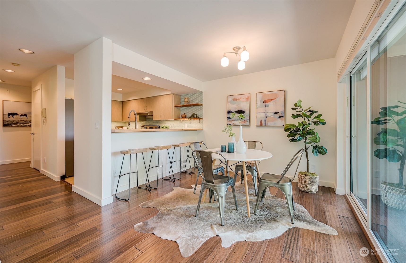 3912 Midvale Avenue North, Unit 201 Seattle, WA 98103 - Photo 6 of 22 a view of a dining room with furniture window and wooden floor