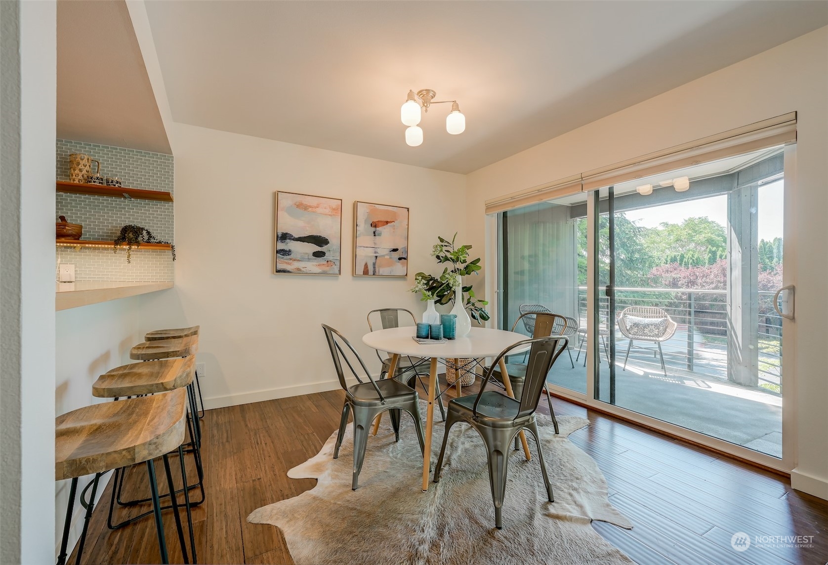 3912 Midvale Avenue North, Unit 201 Seattle, WA 98103 - Photo 8 of 22 a view of a dining room with furniture a chandelier and wooden floor