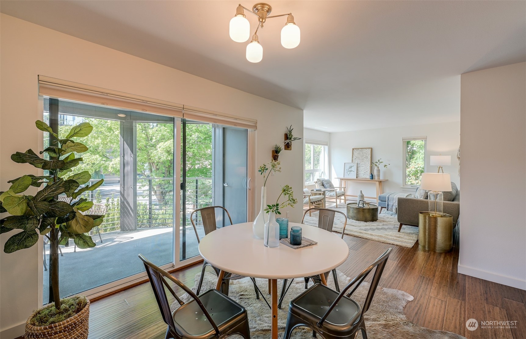 3912 Midvale Avenue North, Unit 201 Seattle, WA 98103 - Photo 10 of 22 a view of a dining room with furniture window and wooden floor