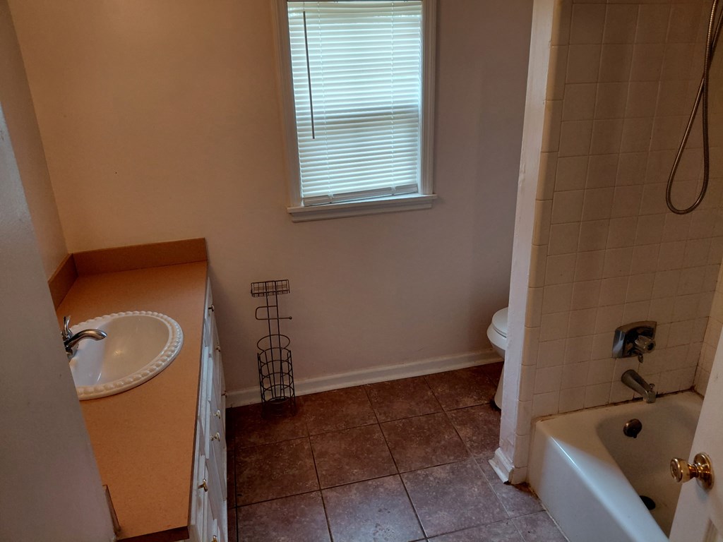 3641 Reese Road Columbus, GA 31907 - Photo 8 of 9 a bathroom with a tub sink and toilet