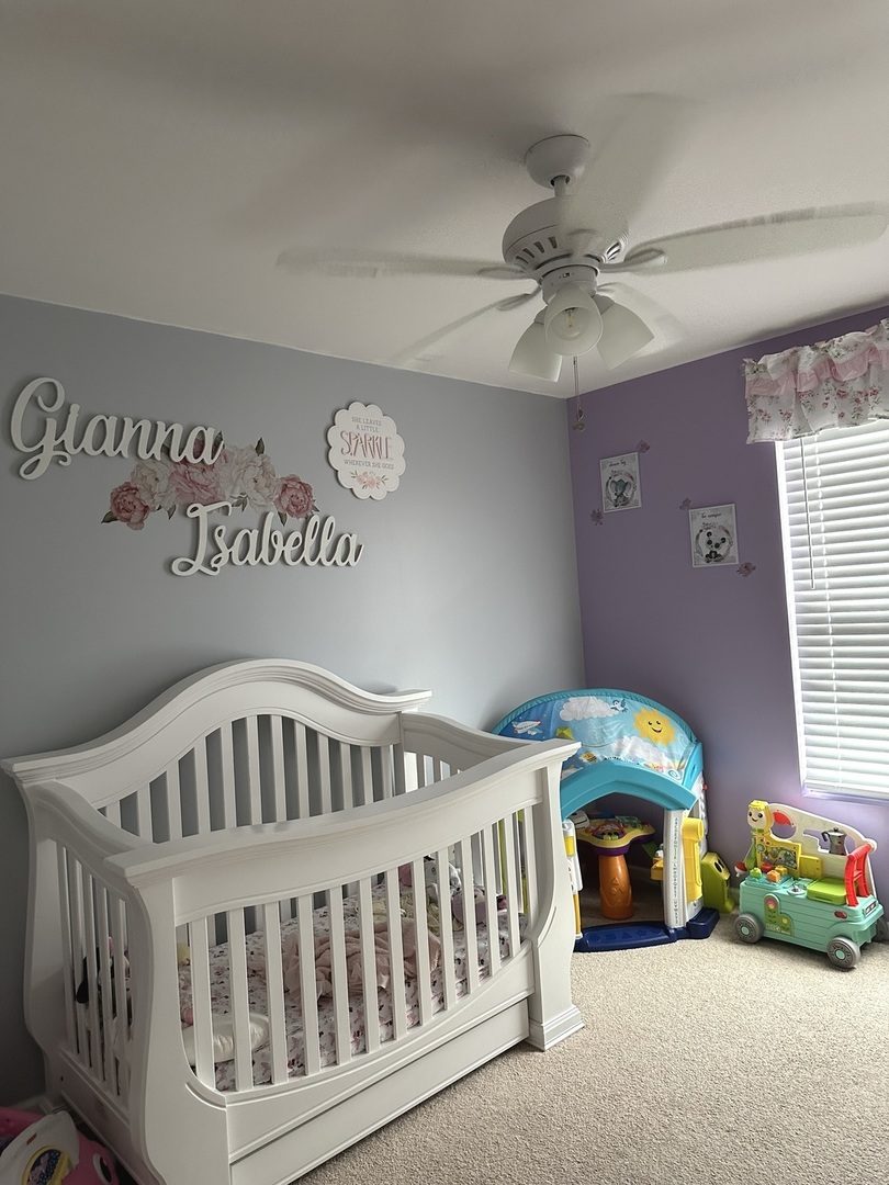 571 Wynbrooke Road Romeoville, IL 60446 - Photo 12 of 15 a bedroom with a bed and windows