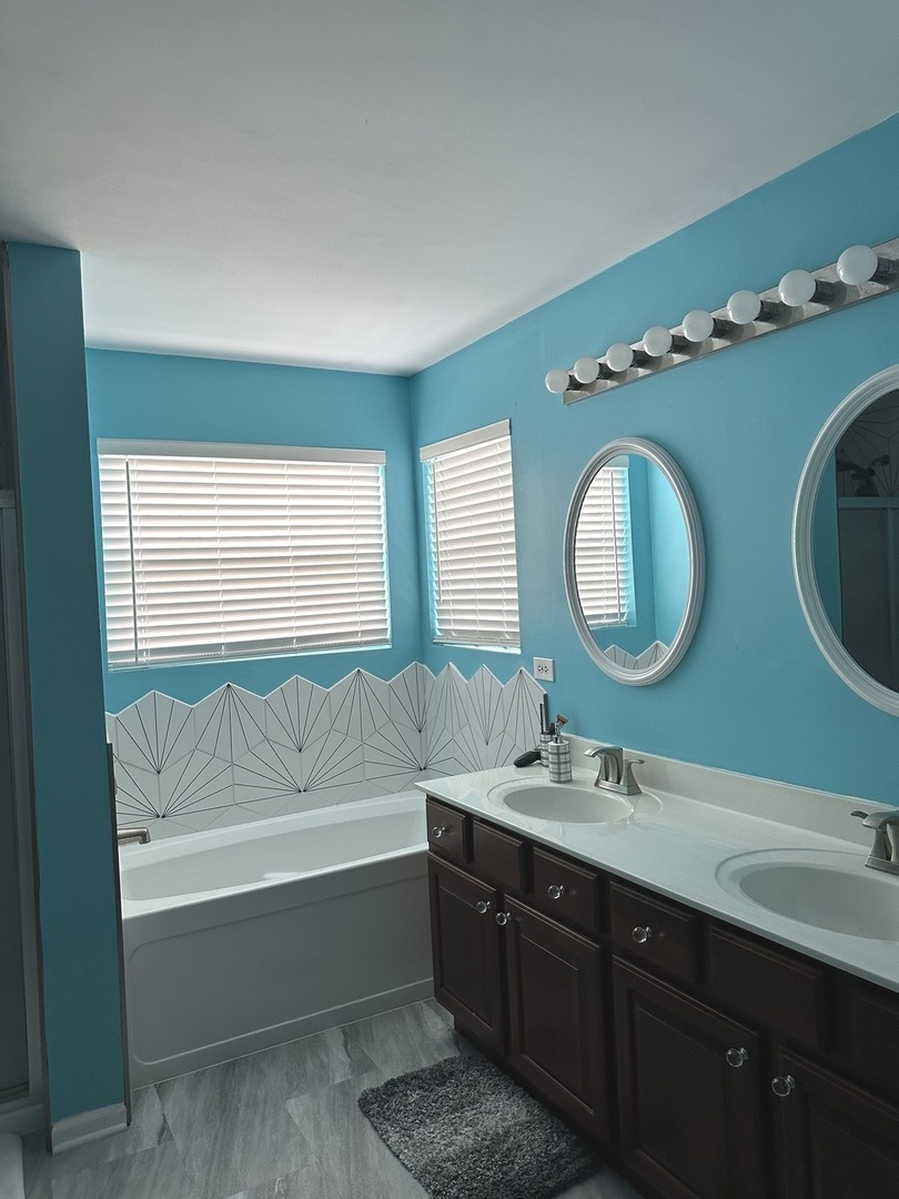 571 Wynbrooke Road Romeoville, IL 60446 - Photo 10 of 15 a bathroom with a double vanity sink and a mirror