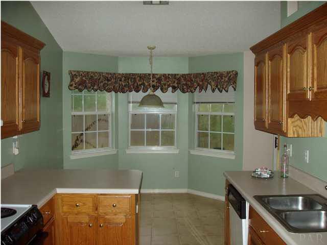 From the hallway looking through the Kitchen to the Breakfast Nook.