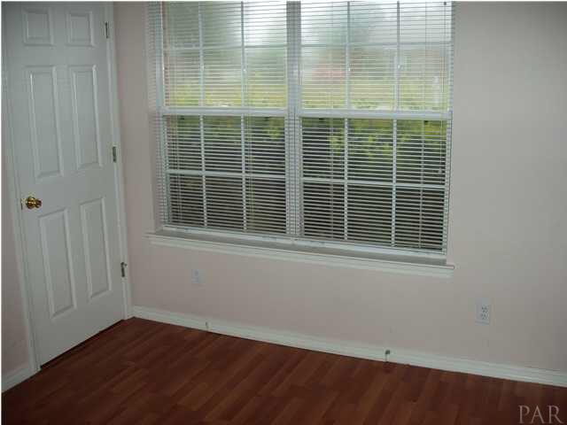 4311 Ridgeland Drive Pace, FL 32571 - Photo 10 of 13 One of three additional bedrooms with plenty of windows inviting in lots of natural light.