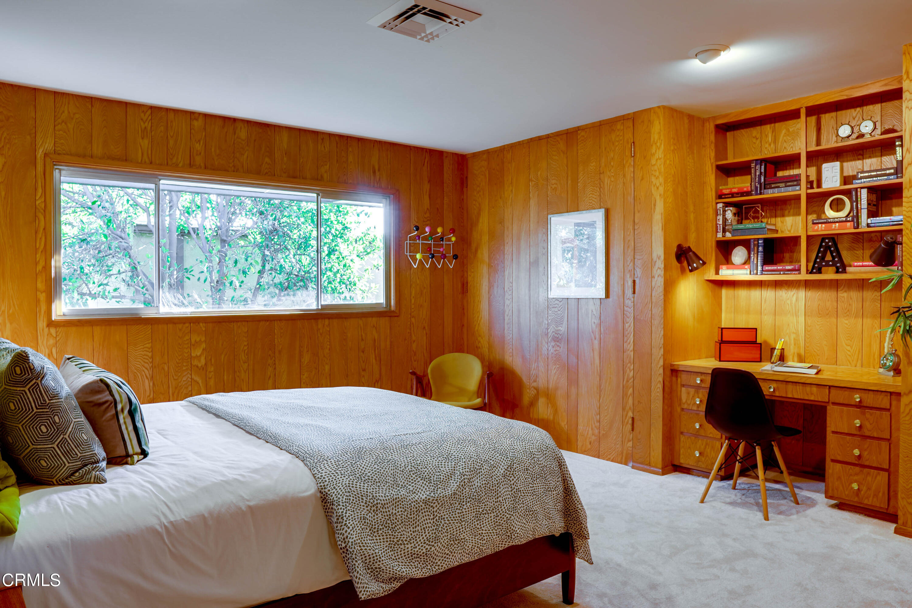 1535 Meadowbrook Road Altadena, CA 91001 - Photo 16 of 32 a bedroom with a bed and a bookshelf