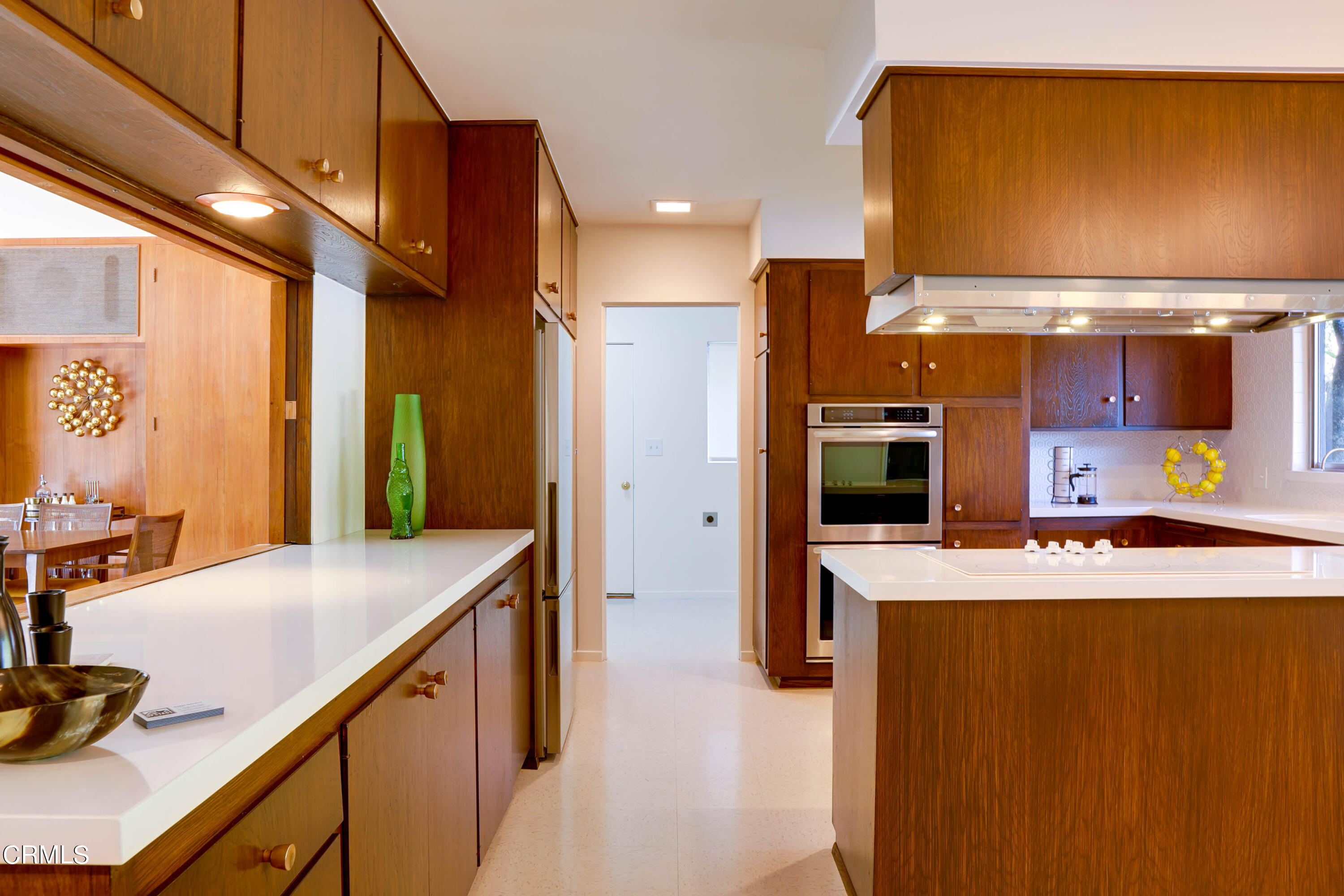 1535 Meadowbrook Road Altadena, CA 91001 - Photo 5 of 32 a kitchen with kitchen island a counter top space a sink wooden floor and a refrigerator
