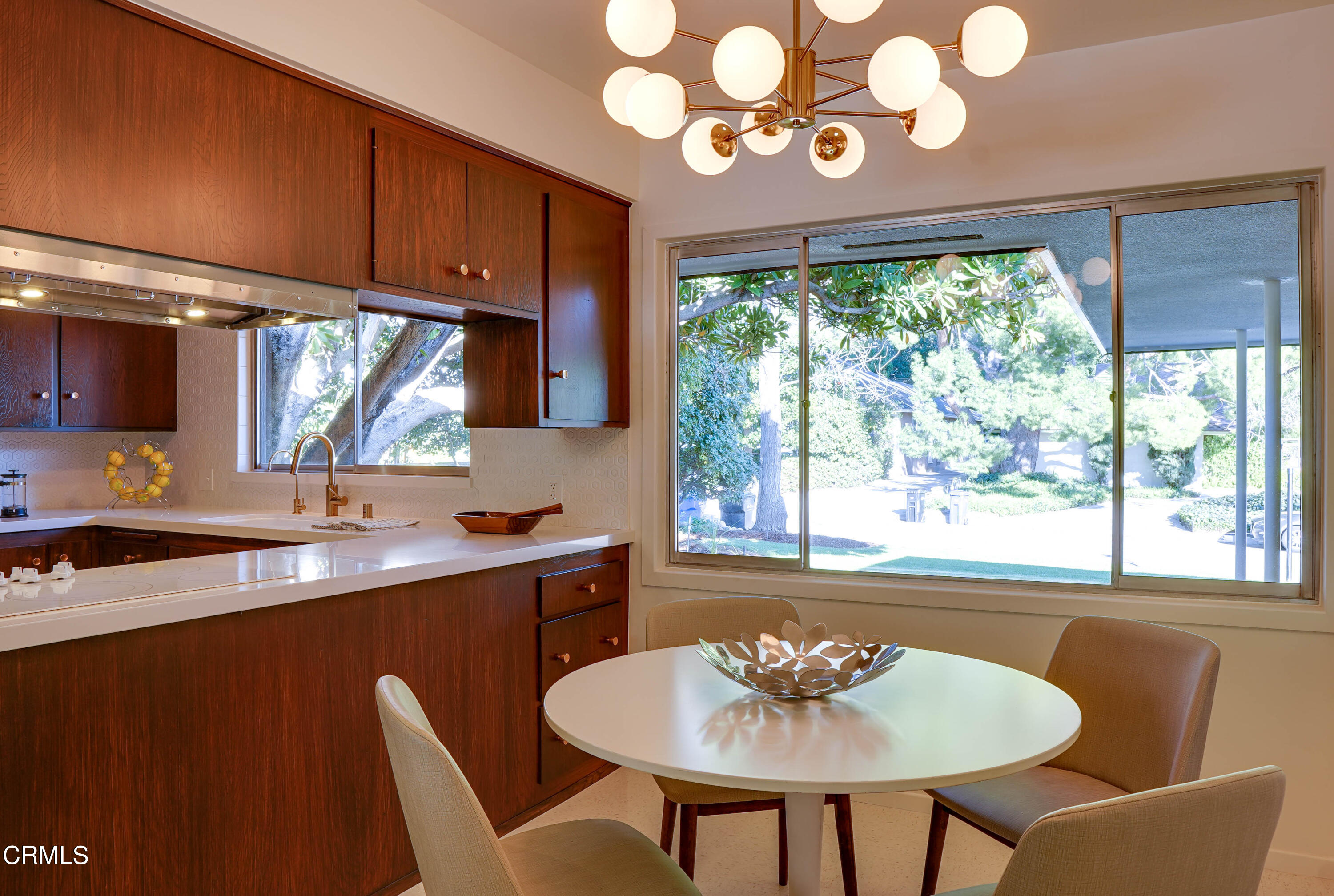 1535 Meadowbrook Road Altadena, CA 91001 - Photo 7 of 32 a kitchen with a table chairs stove and microwave