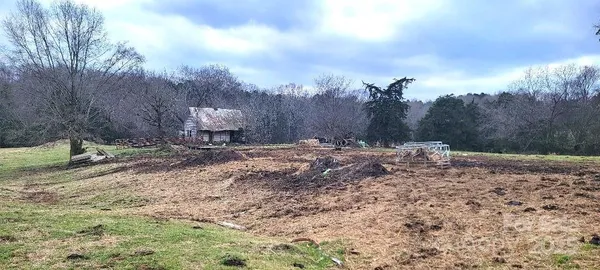 a view of a backyard of the house