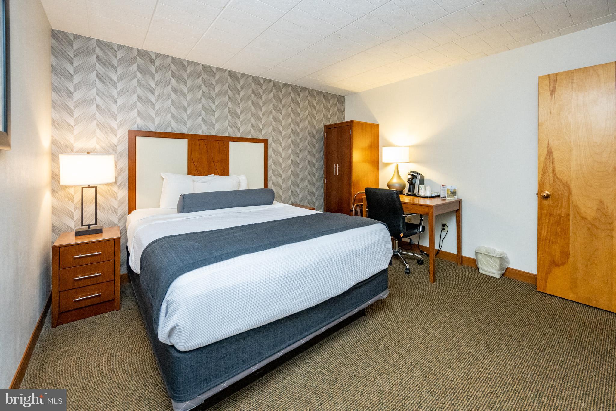 290 Marsh Hill Road, Unit 702K McHenry, MD 21541 - Photo 2 of 45 a bedroom with a bed and a dresser